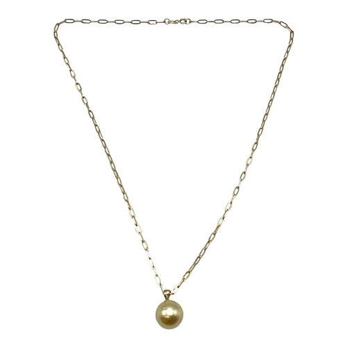 10 - A single golden pearl pendant on 18ct gold bale. Approx 13mm on 9ct gold chain necklace. 46cm. 5.2g.