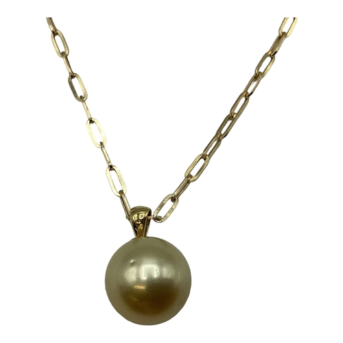 10 - A single golden pearl pendant on 18ct gold bale. Approx 13mm on 9ct gold chain necklace. 46cm. 5.2g.