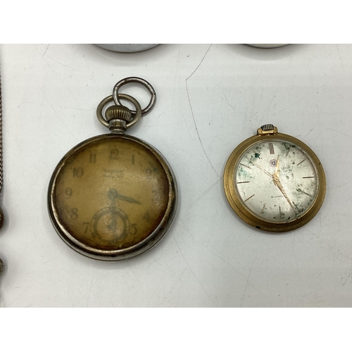 108 - A collection of watches and time pieces to include a 935 silver cased key wind pocket watch