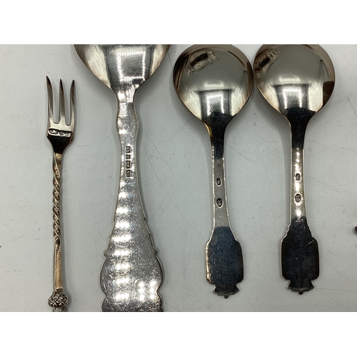 17 - A collection of sterling silver, unmarked white metal and continental white metal items to include a... 