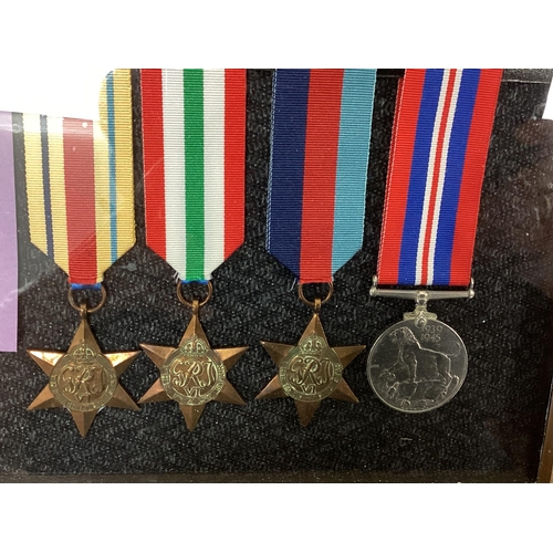 206 - A framed collection of First and Second World war Medals to the Akers family. WWI Trio, WWII Africa ... 