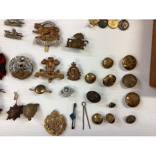 207 - A large collection of military cap badges, various regiments together with a collection of military ... 