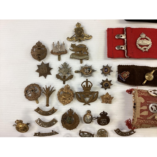 207 - A large collection of military cap badges, various regiments together with a collection of military ... 