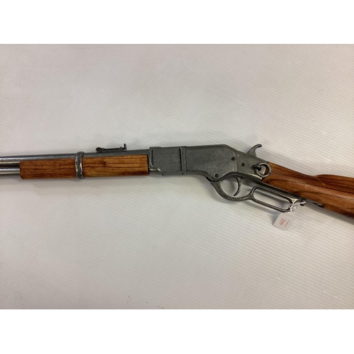 209 - A replica Winchester rifle. Total length 99cm.