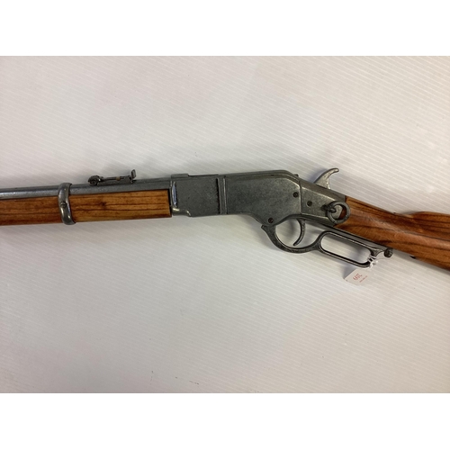 209 - A replica Winchester rifle. Total length 99cm.