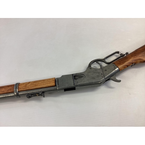 209 - A replica Winchester rifle. Total length 99cm.