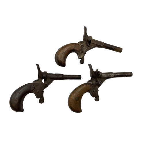 211 - Three 18th century single shot muff pistols one stamped B 110.