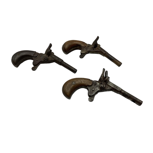 211 - Three 18th century single shot muff pistols one stamped B 110.