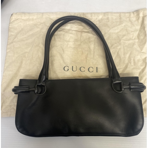 251 - GUCCI, black shoulder bag, number 101345001013, and a Gucci dust cover bag Condition, some wear, see... 