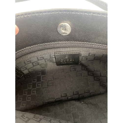 251 - GUCCI, black shoulder bag, number 101345001013, and a Gucci dust cover bag Condition, some wear, see... 