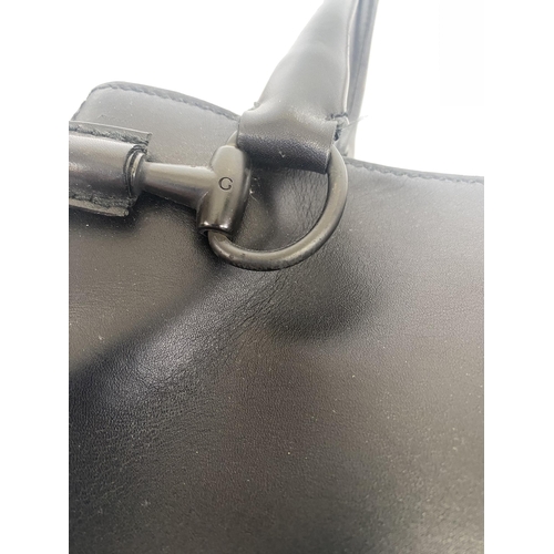 251 - GUCCI, black shoulder bag, number 101345001013, and a Gucci dust cover bag Condition, some wear, see... 