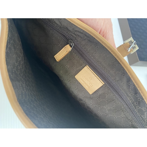 253 - GUCCI, ladies tan shoulder bag, and dust bag,  number 001.3306002058, in used condition, some slight... 