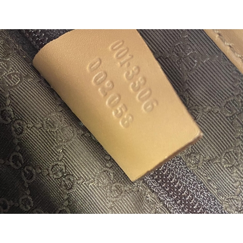 253 - GUCCI, ladies tan shoulder bag, and dust bag,  number 001.3306002058, in used condition, some slight... 