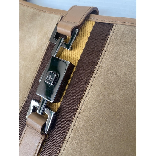 253 - GUCCI, ladies tan shoulder bag, and dust bag,  number 001.3306002058, in used condition, some slight... 