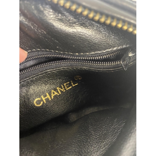 254 - CHANEL, a brown fabric handbag, with original authentication card in envelope, number 5834568, and a... 