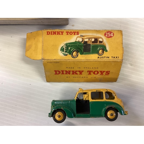 424 - A collection of six boxed Dinky toy trucks and cars to include Guy Flat truck No51, Austin Taxi No25... 