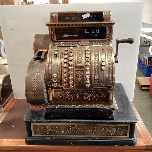 428 - An American brass National cash register. Generally in working order. Keys depress well and handle t... 