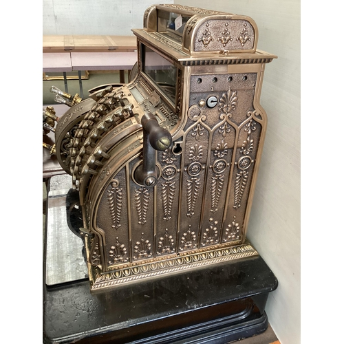 428 - An American brass National cash register. Generally in working order. Keys depress well and handle t... 