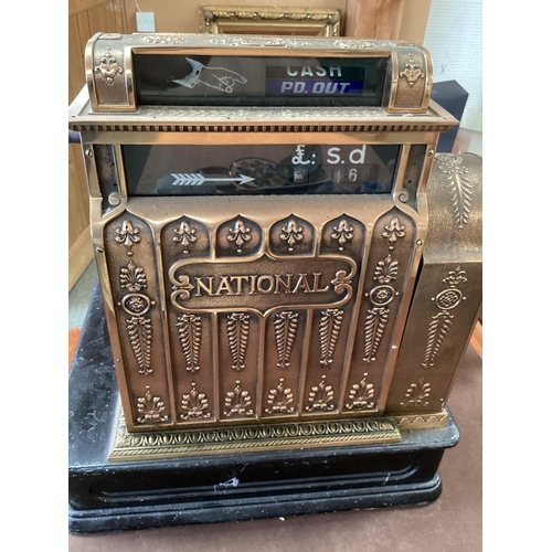 428 - An American brass National cash register. Generally in working order. Keys depress well and handle t... 