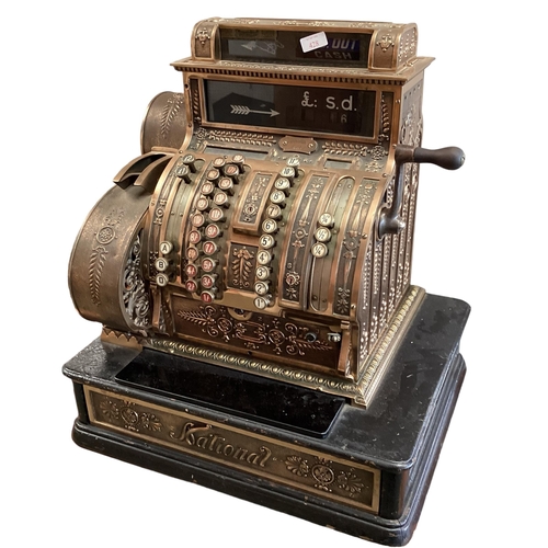 428 - An American brass National cash register. Generally in working order. Keys depress well and handle t... 