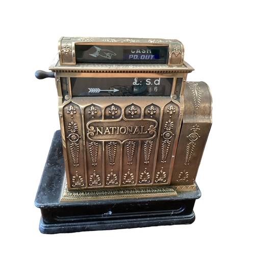 428 - An American brass National cash register. Generally in working order. Keys depress well and handle t... 