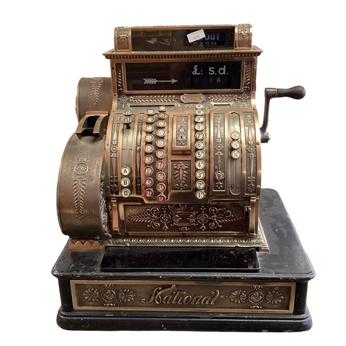 428 - An American brass National cash register. Generally in working order. Keys depress well and handle t... 