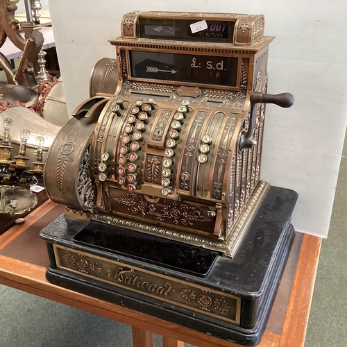 428 - An American brass National cash register. Generally in working order. Keys depress well and handle t... 