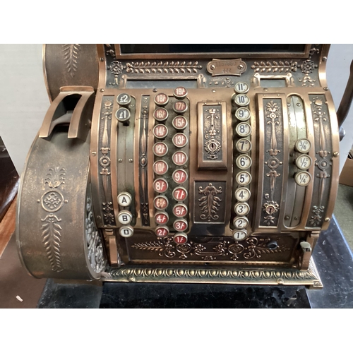 428 - An American brass National cash register. Generally in working order. Keys depress well and handle t... 