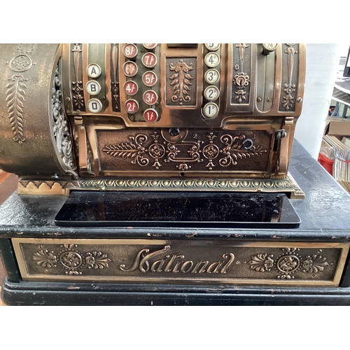 428 - An American brass National cash register. Generally in working order. Keys depress well and handle t... 