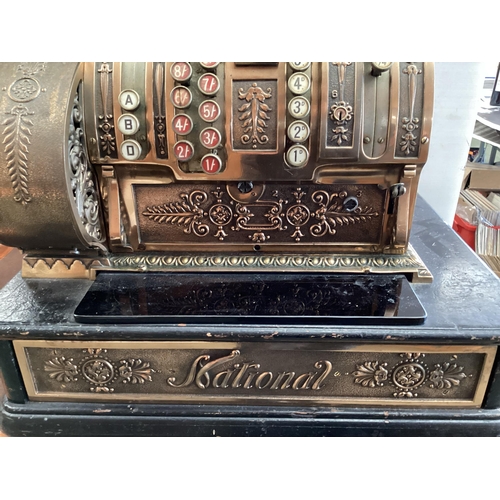 428 - An American brass National cash register. Generally in working order. Keys depress well and handle t... 