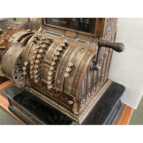 428 - An American brass National cash register. Generally in working order. Keys depress well and handle t... 