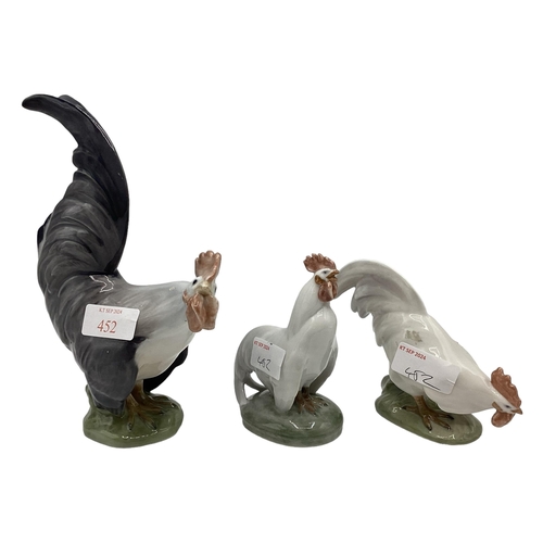 452 - Three Royal Copenhagen models of chickens. Numbered 1126/1127/1025. Largest 20cm(h).