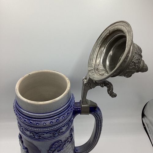 457 - A large stoneware German Beer Stein with pewter lid. 40cm(h)