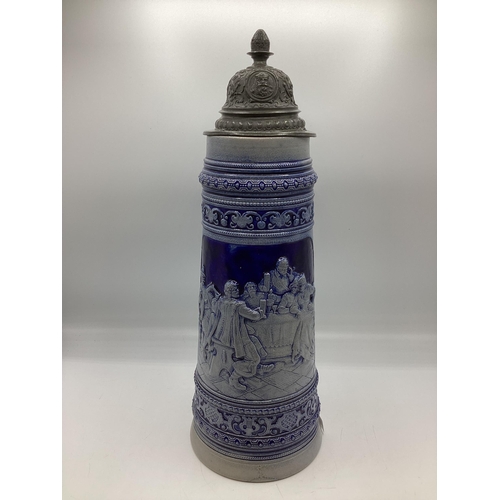 457 - A large stoneware German Beer Stein with pewter lid. 40cm(h)