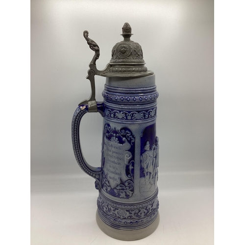 457 - A large stoneware German Beer Stein with pewter lid. 40cm(h)