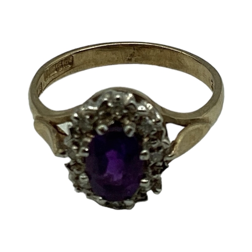 5 - A 9ct gold amethyst and diamond ring. Central oval free cut amethyst with a surround of single cut d... 