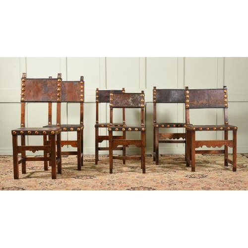 611 - A harlequin set of twelve beech and leather upholstered dining chairs, Spanish, some wear, and a qua... 