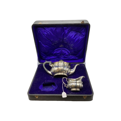 70 - A sterling silver tea pot and cream jug in Mappin and Webb presentation case(missing sugar) by Mappi... 