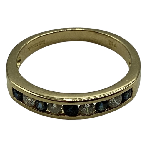 92 - An 18ct gold sapphire and diamond ring. Channel set alternating brilliant  cut diamonds and sapphire... 