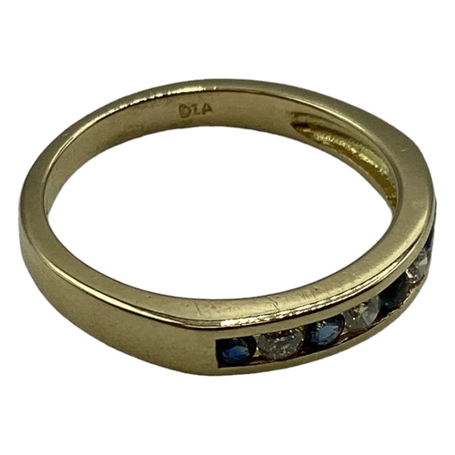 92 - An 18ct gold sapphire and diamond ring. Channel set alternating brilliant  cut diamonds and sapphire... 