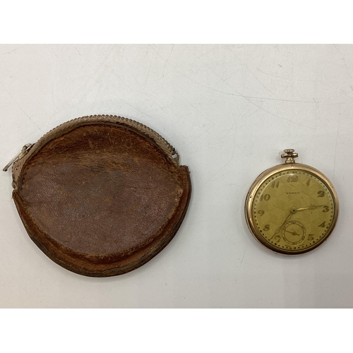 94 - A yellow metal crown wind pocket watch by tempo with engine turned face.