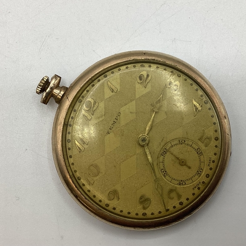 94 - A yellow metal crown wind pocket watch by tempo with engine turned face.