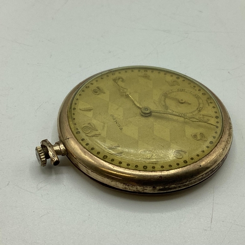 94 - A yellow metal crown wind pocket watch by tempo with engine turned face.