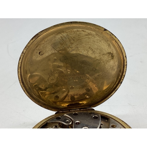 94 - A yellow metal crown wind pocket watch by tempo with engine turned face.