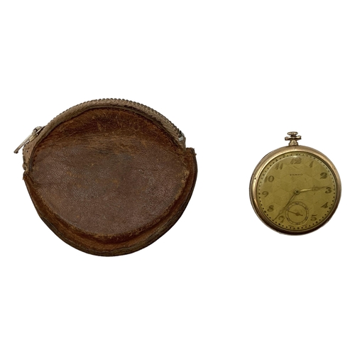 94 - A yellow metal crown wind pocket watch by tempo with engine turned face.