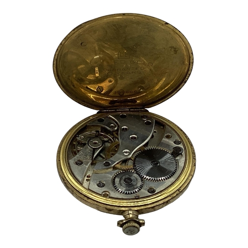 94 - A yellow metal crown wind pocket watch by tempo with engine turned face.