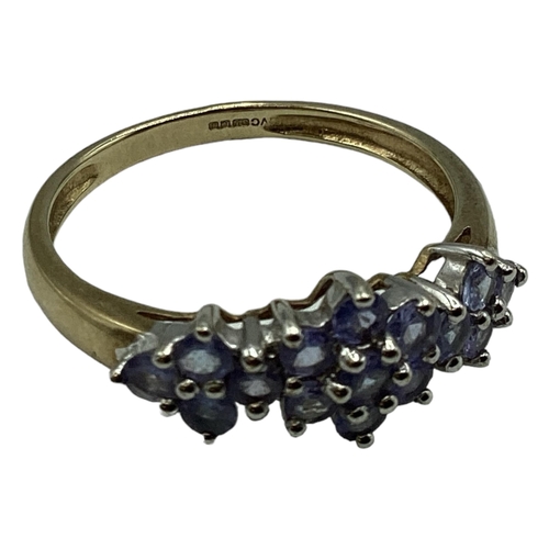 98 - A 9ct gold and tanzanite cluster ring. Size T. 2.4g.