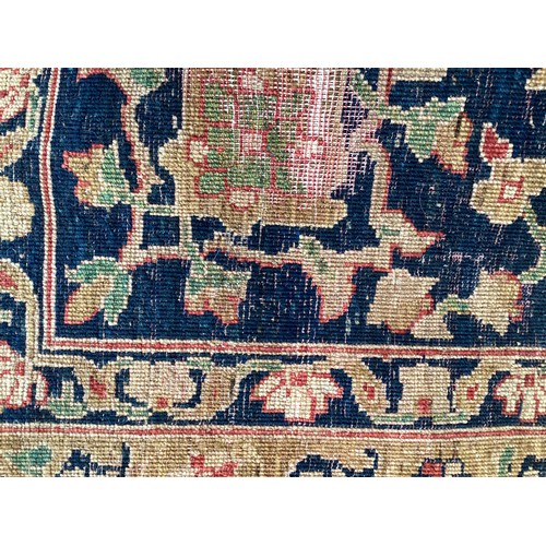 707 - A large good quality red ground rug, some wear and fraying to edge commensurate with age and use 436... 