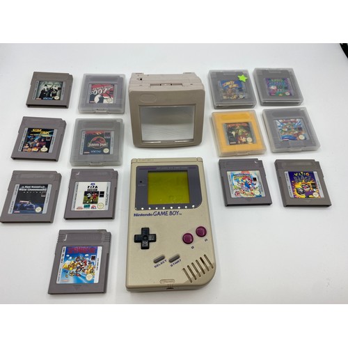 353 - Game boy with original carry case and games.  Super Mario Land 6 Golden Coins, Donkey King Land 2, E... 