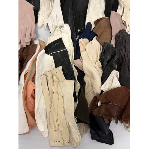 283 - A large quantity of vintage gloves and a pair of glove stretchers